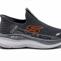 Newstep Propulsion Max Run black slip-on running sneakers with orange detailing