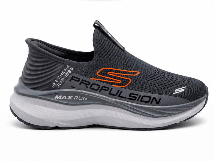 Newstep Propulsion Max Run black slip-on running sneakers with orange detailing